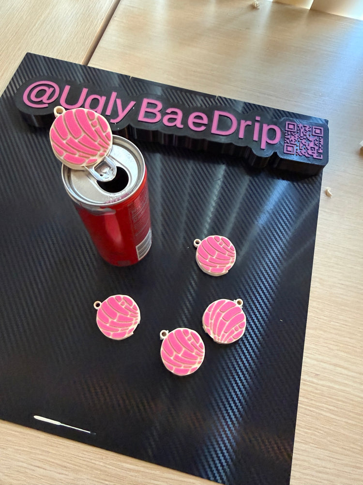 Pink concha nail saver lifting a soda can tab