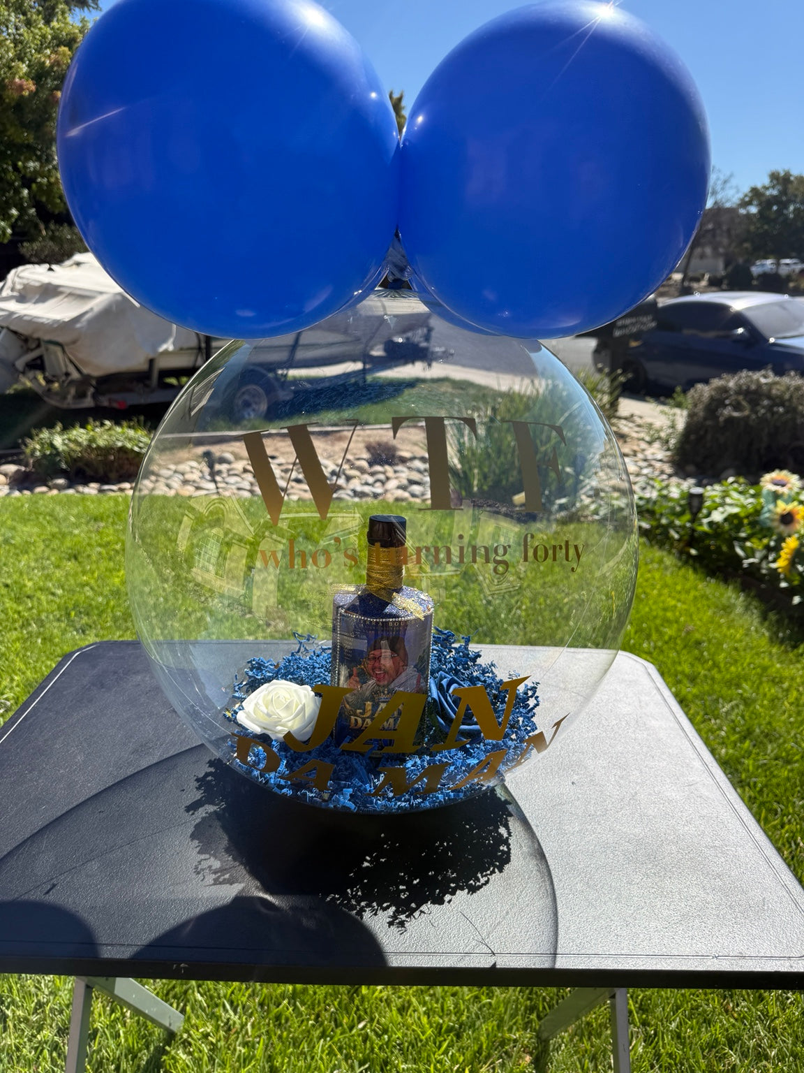 Custom stuffed balloon with customer-provided bling bottle and personalized photo label