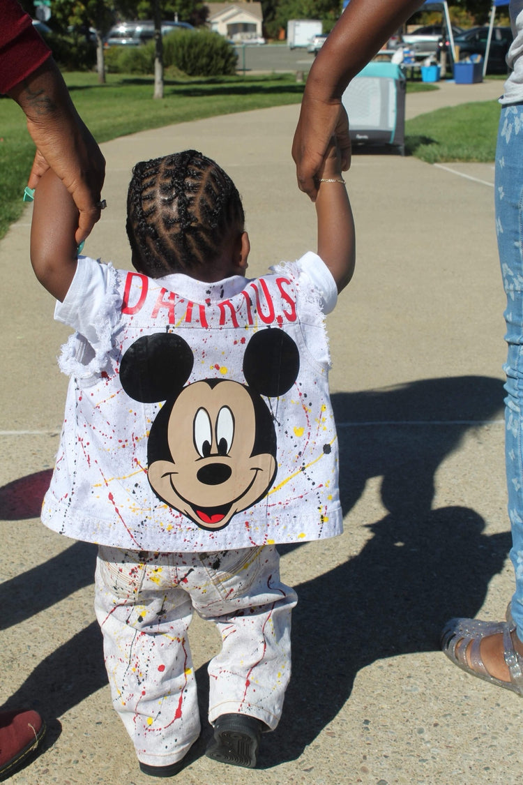 Back view of personalized hand-painted toddler denim vest and jeans