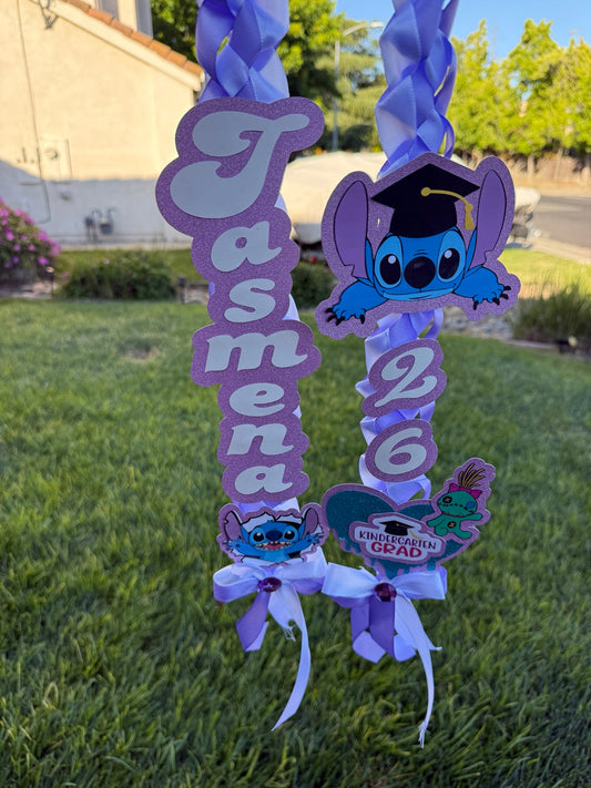 Purple personalized graduation ribbon lei with name, 2026 year, and themed embellishments