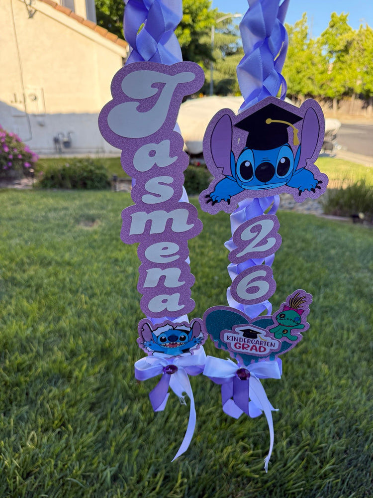 Purple personalized graduation ribbon lei with name, 2026 year, and themed embellishments