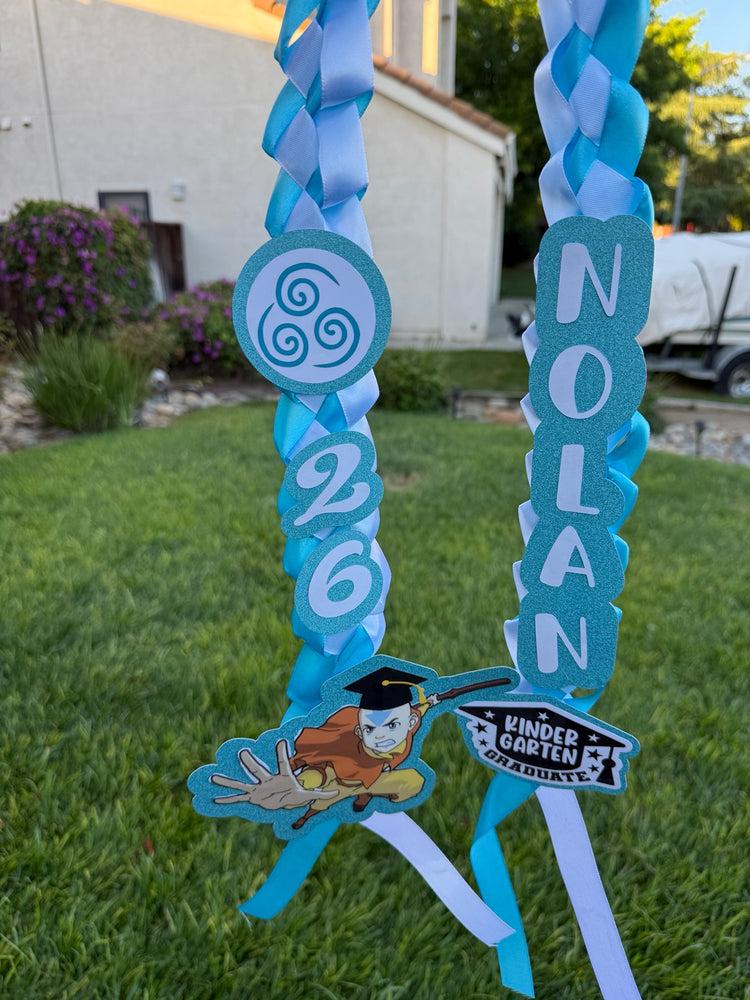 Blue personalized graduation ribbon lei with name, 2026 year, and themed embellishments