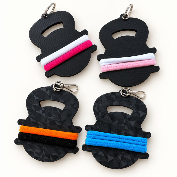 Black hair tie holder keychains with colorful hair ties; sold individually with 2 hair ties included