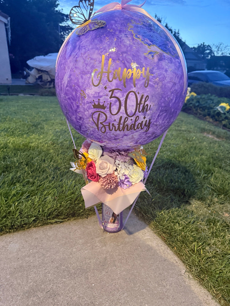 Purple personalized birthday balloon bouquet with glitter wine bottle and custom photo label